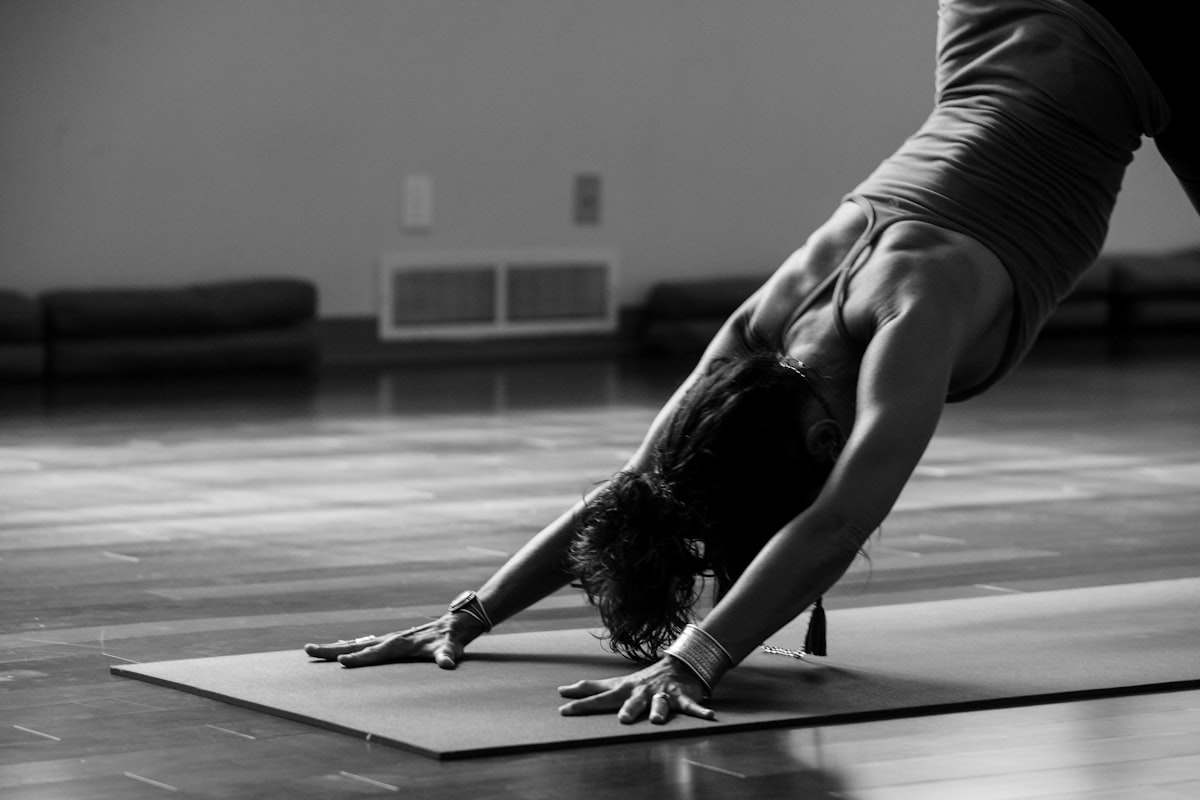 Yoga practitioner in warrior pose demonstrating strength and stability